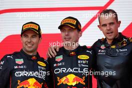 (L to R): Sergio Perez (MEX) Red Bull Racing celebrates his second position on the podium with race winner and team mate Max Verstappen (NLD) Red Bull Racing; and Tom Hart (GBR) Red Bull Racing Performance Engineer.. 12.06.2022. Formula 1 World Championship, Rd 8, Azerbaijan Grand Prix, Baku Street Circuit, Azerbaijan, Race Day.