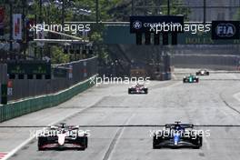 (L to R): Kevin Magnussen (DEN) Haas VF-22 and Alexander Albon (THA) Williams Racing FW44 battle for position. 12.06.2022. Formula 1 World Championship, Rd 8, Azerbaijan Grand Prix, Baku Street Circuit, Azerbaijan, Race Day.