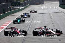 (L to R): Valtteri Bottas (FIN) Alfa Romeo F1 Team C42 and Kevin Magnussen (DEN) Haas VF-22 battle for position. 12.06.2022. Formula 1 World Championship, Rd 8, Azerbaijan Grand Prix, Baku Street Circuit, Azerbaijan, Race Day.