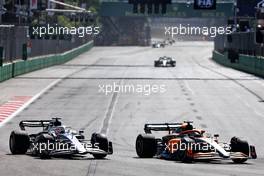 Pierre Gasly (FRA) AlphaTauri AT03 and Daniel Ricciardo (AUS) McLaren MCL36 battle for position. 12.06.2022. Formula 1 World Championship, Rd 8, Azerbaijan Grand Prix, Baku Street Circuit, Azerbaijan, Race Day.