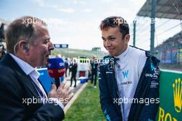 Alexander Albon (THA) Williams Racing with Martin Brundle (GBR) Sky Sports Commentator on the grid. 28.08.2022. Formula 1 World Championship, Rd 14, Belgian Grand Prix, Spa Francorchamps, Belgium, Race Day.