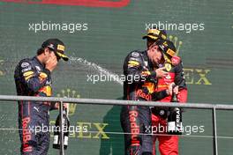 (L to R): Sergio Perez (MEX) Red Bull Racing celebrates with race winner and team mate Max Verstappen (NLD) Red Bull Racing on the podium. 28.08.2022. Formula 1 World Championship, Rd 14, Belgian Grand Prix, Spa Francorchamps, Belgium, Race Day.