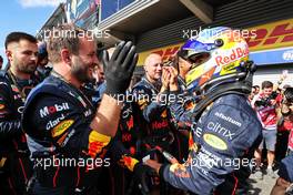 Sergio Perez (MEX) Red Bull Racing celebrates his second position with the team in parc ferme. 28.08.2022. Formula 1 World Championship, Rd 14, Belgian Grand Prix, Spa Francorchamps, Belgium, Race Day.