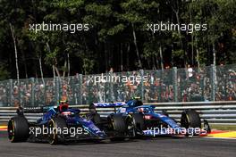 (L to R): Nicholas Latifi (CDN) Williams Racing FW44 and Esteban Ocon (FRA) Alpine F1 Team A522 battle for position at the start of the race. 28.08.2022. Formula 1 World Championship, Rd 14, Belgian Grand Prix, Spa Francorchamps, Belgium, Race Day.