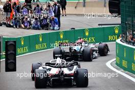 George Russell (GBR) Mercedes AMG F1 W13 and Kevin Magnussen (DEN) Haas VF-22 leave the pits. 27.08.2022. Formula 1 World Championship, Rd 14, Belgian Grand Prix, Spa Francorchamps, Belgium, Qualifying Day.