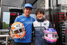 (L to R): Fernando Alonso (ESP) Alpine F1 Team swapping helmets with Yuki Tsunoda (JPN) AlphaTauri. 27.08.2022. Formula 1 World Championship, Rd 14, Belgian Grand Prix, Spa Francorchamps, Belgium, Qualifying Day.