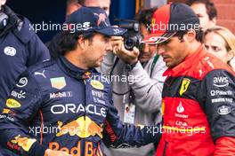 (L to R): Sergio Perez (MEX) Red Bull Racing with Carlos Sainz Jr (ESP) Ferrari in qualifying parc ferme. 27.08.2022. Formula 1 World Championship, Rd 14, Belgian Grand Prix, Spa Francorchamps, Belgium, Qualifying Day.