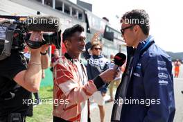 (L to R): Lawrence Barretto (GBR) Formula 1 Senior Writer Editor with Alexander Albon (THA) Williams Racing on the drivers parade. 28.08.2022. Formula 1 World Championship, Rd 14, Belgian Grand Prix, Spa Francorchamps, Belgium, Race Day.