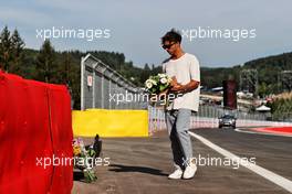 Pierre Gasly (FRA) AlphaTauri pays his respects to Anthoine Hubert. 25.08.2022. Formula 1 World Championship, Rd 14, Belgian Grand Prix, Spa Francorchamps, Belgium, Preparation Day.