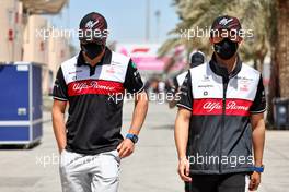 (L to R): Valtteri Bottas (FIN) Alfa Romeo F1 Team and Guanyu Zhou (CHN) Alfa Romeo F1 Team. 18.03.2022. Formula 1 World Championship, Rd 1, Bahrain Grand Prix, Sakhir, Bahrain, Practice Day