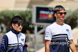 (L to R): Yuki Tsunoda (JPN) AlphaTauri with team mate Pierre Gasly (FRA) AlphaTauri. 18.03.2022. Formula 1 World Championship, Rd 1, Bahrain Grand Prix, Sakhir, Bahrain, Practice Day