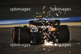Lando Norris (GBR) McLaren MCL36 sends sparks flying. 18.03.2022. Formula 1 World Championship, Rd 1, Bahrain Grand Prix, Sakhir, Bahrain, Practice Day