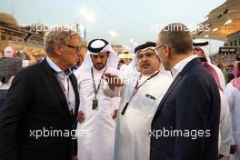 (L to R): Hermann Tilke (GER) Circuit Designer with Mohammed Bin Sulayem (UAE) FIA President; Crown Prince Shaikh Salman bin Isa Hamad Al Khalifa (BRN); and Stefano Domenicali (ITA) Formula One President and CEO, on the grid. 20.03.2022. Formula 1 World Championship, Rd 1, Bahrain Grand Prix, Sakhir, Bahrain, Race Day.