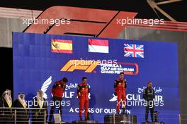 The podium (L to R): Mattia Binotto (ITA) Ferrari Team Principal; Carlos Sainz Jr (ESP) Ferrari, second; Charles Leclerc (MON) Ferrari, race winner; Lewis Hamilton (GBR) Mercedes AMG F1, third. 20.03.2022. Formula 1 World Championship, Rd 1, Bahrain Grand Prix, Sakhir, Bahrain, Race Day.