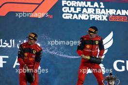 Race winner Charles Leclerc (MON) Ferrari (Right) celebrates on the podium with second placed team mate Carlos Sainz Jr (ESP) Ferrari. 20.03.2022. Formula 1 World Championship, Rd 1, Bahrain Grand Prix, Sakhir, Bahrain, Race Day.