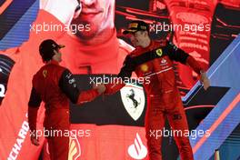 (L to R): Carlos Sainz Jr (ESP) Ferrari celebrates his second position on the podium with race winner Charles Leclerc (MON) Ferrari. 20.03.2022. Formula 1 World Championship, Rd 1, Bahrain Grand Prix, Sakhir, Bahrain, Race Day.