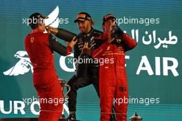 Race winner Charles Leclerc (MON) Ferrari celebrates on the podium with second placed team mate Carlos Sainz Jr (ESP) Ferrari and Lewis Hamilton (GBR) Mercedes AMG F1. 20.03.2022. Formula 1 World Championship, Rd 1, Bahrain Grand Prix, Sakhir, Bahrain, Race Day.