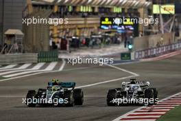 Lewis Hamilton (GBR) Mercedes AMG F1 W13 and Pierre Gasly (FRA) AlphaTauri AT03. 20.03.2022. Formula 1 World Championship, Rd 1, Bahrain Grand Prix, Sakhir, Bahrain, Race Day.