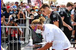 Lewis Hamilton (GBR) Mercedes AMG F1 and George Russell (GBR) Mercedes AMG F1 sign autographs for the fans. 19.03.2022. Formula 1 World Championship, Rd 1, Bahrain Grand Prix, Sakhir, Bahrain, Qualifying Day.