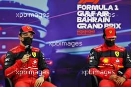 (L to R): Charles Leclerc (MON) Ferrari and team mate Carlos Sainz Jr (ESP) Ferrari in the post qualifying FIA Press Conference. 19.03.2022. Formula 1 World Championship, Rd 1, Bahrain Grand Prix, Sakhir, Bahrain, Qualifying Day.