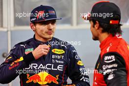 (L to R): Max Verstappen (NLD) Red Bull Racing with Carlos Sainz Jr (ESP) Ferrari in qualifying parc ferme. 19.03.2022. Formula 1 World Championship, Rd 1, Bahrain Grand Prix, Sakhir, Bahrain, Qualifying Day.