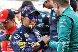 (L to R): Sergio Perez (MEX) Red Bull Racing and Nico Hulkenberg (GER) Aston Martin F1 Team Reserve Driver at the start of season driver's photograph. 20.03.2022. Formula 1 World Championship, Rd 1, Bahrain Grand Prix, Sakhir, Bahrain, Race Day.
