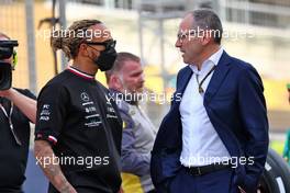 (L to R): Lewis Hamilton (GBR) Mercedes AMG F1 with Stefano Domenicali (ITA) Formula One President and CEO. 20.03.2022. Formula 1 World Championship, Rd 1, Bahrain Grand Prix, Sakhir, Bahrain, Race Day.
