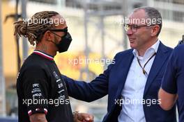 (L to R): Lewis Hamilton (GBR) Mercedes AMG F1 with Stefano Domenicali (ITA) Formula One President and CEO. 20.03.2022. Formula 1 World Championship, Rd 1, Bahrain Grand Prix, Sakhir, Bahrain, Race Day.