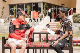 (L to R): Charles Leclerc (MON) Ferrari and Lawrence Barretto (GBR) Formula 1 Senior Writer Editor. 17.03.2022. Formula 1 World Championship, Rd 1, Bahrain Grand Prix, Sakhir, Bahrain, Preparation Day.