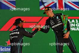 (L to R): second placed Lewis Hamilton (GBR) Mercedes AMG F1 and race winner George Russell (GBR) Mercedes AMG F1 on the podium. 13.11.2022. Formula 1 World Championship, Rd 21, Brazilian Grand Prix, Sao Paulo, Brazil, Race Day.
