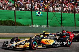 Charles Leclerc (MON) Ferrari F1-75 and Lando Norris (GBR) McLaren MCL36 battle for position. 13.11.2022. Formula 1 World Championship, Rd 21, Brazilian Grand Prix, Sao Paulo, Brazil, Race Day.