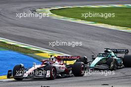 Guanyu Zhou (CHN) Alfa Romeo F1 Team C42 and Lance Stroll (CDN) Aston Martin F1 Team AMR22 battle for position. 13.11.2022. Formula 1 World Championship, Rd 21, Brazilian Grand Prix, Sao Paulo, Brazil, Race Day.