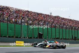 Lewis Hamilton (GBR) Mercedes AMG F1 W13 and Sergio Perez (MEX) Red Bull Racing RB18 battle for position. 13.11.2022. Formula 1 World Championship, Rd 21, Brazilian Grand Prix, Sao Paulo, Brazil, Race Day.