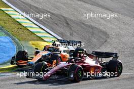 Carlos Sainz Jr (ESP) Ferrari F1-75 and Lando Norris (GBR) McLaren MCL36 battle for position. 12.11.2022. Formula 1 World Championship, Rd 21, Brazilian Grand Prix, Sao Paulo, Brazil, Sprint Day.