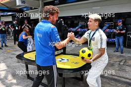 Fernando Alonso (ESP) Alpine F1 Team plays football with Yeferson Soteldo (VEN) Santos Football Player  12.11.2022. Formula 1 World Championship, Rd 21, Brazilian Grand Prix, Sao Paulo, Brazil, Sprint Day.