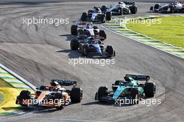 Daniel Ricciardo (AUS) McLaren MCL36 and Sebastian Vettel (GER) Aston Martin F1 Team AMR22 battle for position. 12.11.2022. Formula 1 World Championship, Rd 21, Brazilian Grand Prix, Sao Paulo, Brazil, Sprint Day.