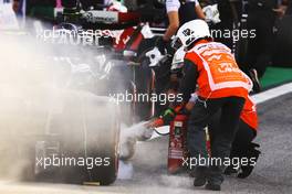 The Alpine F1 Team A522 of Esteban Ocon (FRA) catches fire in parc ferme at the end of Sprint with fire marshals extinguishing the flames. 12.11.2022. Formula 1 World Championship, Rd 21, Brazilian Grand Prix, Sao Paulo, Brazil, Sprint Day.