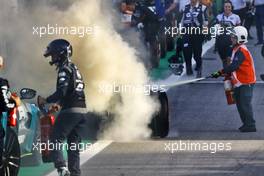 The Alpine F1 Team A522 of Esteban Ocon (FRA) catches fire in parc ferme at the end of Sprint with a fire marshal extinguishing the flames. 12.11.2022. Formula 1 World Championship, Rd 21, Brazilian Grand Prix, Sao Paulo, Brazil, Sprint Day.