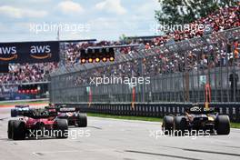 Carlos Sainz Jr (ESP) Ferrari F1-75 and Daniel Ricciardo (AUS) McLaren MCL36 - practice starts at the end of the first practice session. 17.06.2022. Formula 1 World Championship, Rd 9, Canadian Grand Prix, Montreal, Canada, Practice Day.