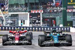 (L to R): Guanyu Zhou (CHN) Alfa Romeo F1 Team C42 and Lance Stroll (CDN) Aston Martin F1 Team AMR22. 19.06.2022. Formula 1 World Championship, Rd 9, Canadian Grand Prix, Montreal, Canada, Race Day.