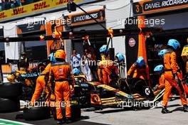 Lando Norris (GBR) McLaren MCL36 makes a pit stop. 19.06.2022. Formula 1 World Championship, Rd 9, Canadian Grand Prix, Montreal, Canada, Race Day.