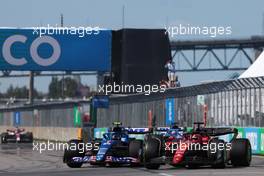 Esteban Ocon (FRA) Alpine F1 Team A522 and Charles Leclerc (MON) Ferrari F1-75. 19.06.2022. Formula 1 World Championship, Rd 9, Canadian Grand Prix, Montreal, Canada, Race Day.