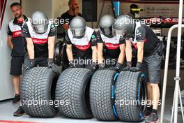 Alfa Romeo F1 Team mechanics with wet Pirelli tyres. 16.06.2022. Formula 1 World Championship, Rd 9, Canadian Grand Prix, Montreal, Canada, Preparation Day.