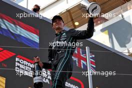 George Russell (GBR) Mercedes AMG F1 celebrates his third position on the podium. 22.05.2022. Formula 1 World Championship, Rd 6, Spanish Grand Prix, Barcelona, Spain, Race Day.