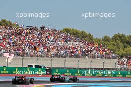George Russell (GBR) Mercedes AMG F1 W13 leads Sergio Perez (MEX) Red Bull Racing RB18. 24.07.2022. Formula 1 World Championship, Rd 12, French Grand Prix, Paul Ricard, France, Race Day.