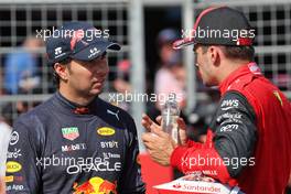 (L to R): Sergio Perez (MEX) Red Bull Racing with pole sitter Charles Leclerc (MON) Ferrari in qualifying parc ferme. 23.07.2022. Formula 1 World Championship, Rd 12, French Grand Prix, Paul Ricard, France, Qualifying Day.