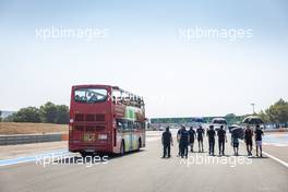 Nicholas Latifi (CDN) Williams Racing walks the circuit with the team - passed by a bus. 21.07.2022. Formula 1 World Championship, Rd 12, French Grand Prix, Paul Ricard, France, Preparation Day.