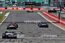Nicholas Latifi (CDN) Williams Racing FW44 and Pierre Gasly (FRA) AlphaTauri AT03 - practice starts. 01.07.2022. Formula 1 World Championship, Rd 10, British Grand Prix, Silverstone, England, Practice Day.