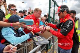 Carlos Sainz Jr (ESP) Ferrari signs autographs for the fans. 01.07.2022. Formula 1 World Championship, Rd 10, British Grand Prix, Silverstone, England, Practice Day.