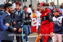 (L to R): Mohammed Bin Sulayem (UAE) FIA President and Charles Leclerc (MON) Ferrari on the grid. 03.07.2022. Formula 1 World Championship, Rd 10, British Grand Prix, Silverstone, England, Race Day.